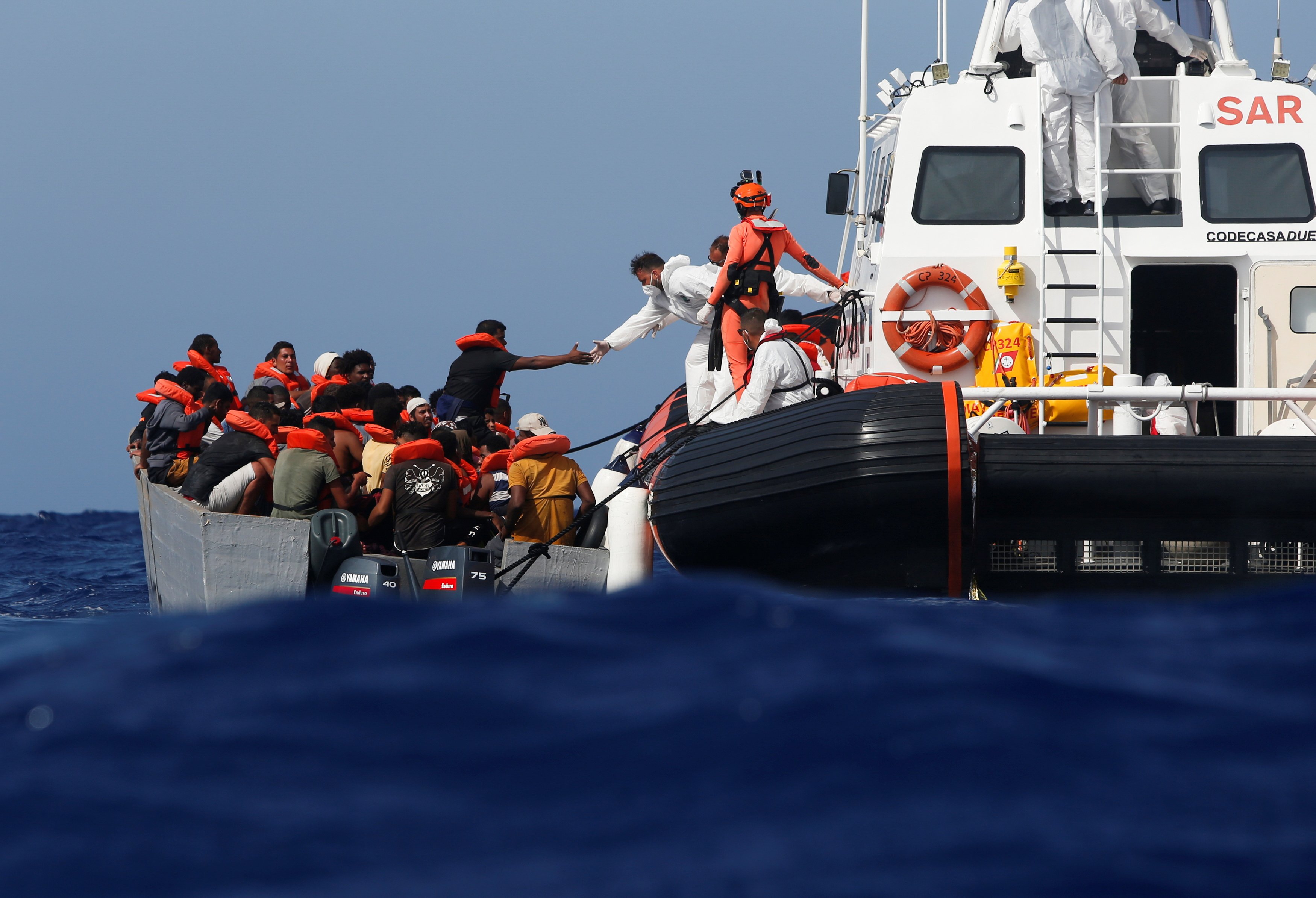 Hundreds of migrants stuck in limbo on rescue boats in Mediterranean ...
