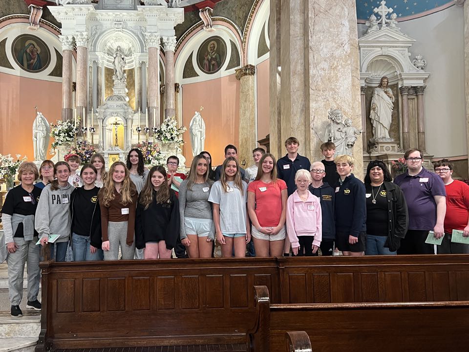 A group of young adults from the Delco Young Disciples pose together during their year-end visit to the National Shrine of St. Rita of Cascia in South Philadelphia.