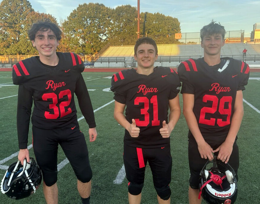 From left, Archbishop Ryan snapper Ryan DeMas, kicker Thanas Strati, and holder Neil Carr held their nerves in game-winning boot that gave Archbishop Ryan a 3-0 Philadelphia Catholic League Blue Division title Oct. 18 at Northeast High School, Philadelphia. (Photo by John Knebels)